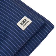 roka-chelsea-b-medium-recycled-canvas-sling-bag---dark-denim-pinstripe-blue-34459967